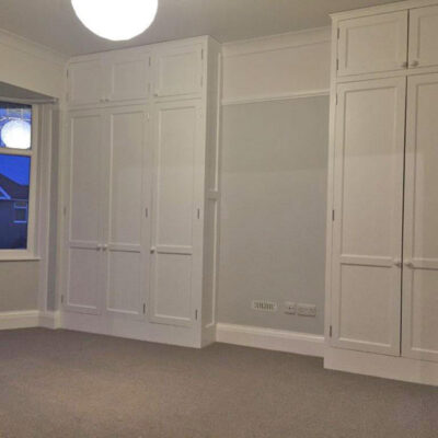 White flat panel wardrobe doors in a bedroom