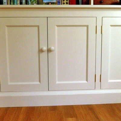 White flat panel cupboard doors in a living room